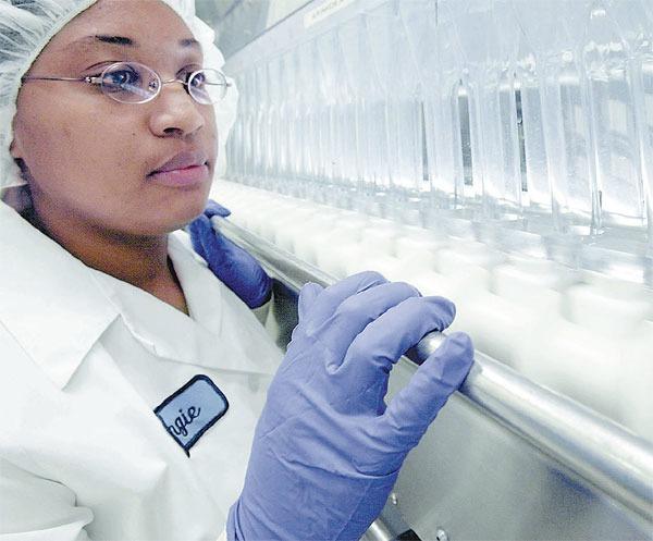 An employee of AstraZenecas plant in the United States inspects the production line of the lung cancer drug Iressa