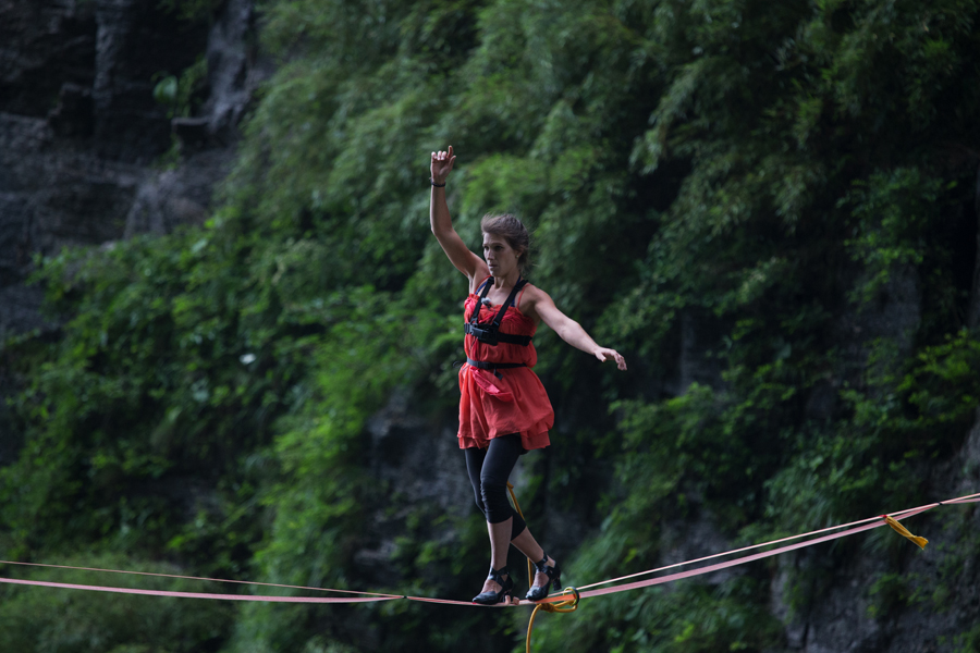 Mimi Guesdon 32 finishes in nine minutes and 24 seconds to win the 2018 Tianmen Mountain Female High heeled Highline Challenge in Central Chinas Hunan province