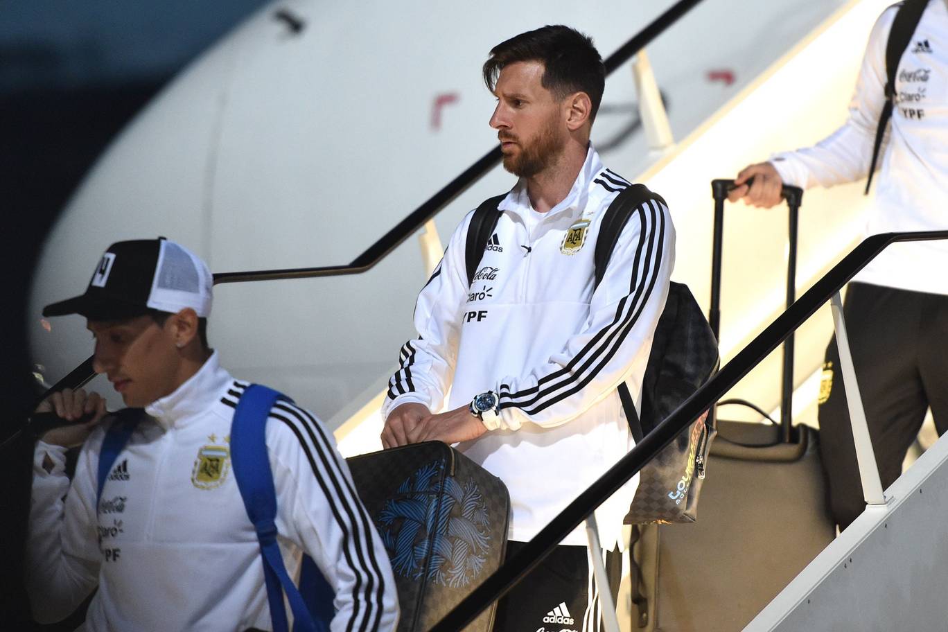Argentinas forward Lionel Messi R disembarks from a plane at the Zhukovsky airport near Moscow as Argentinas national football team arrives ahead of the Russia 2018 World Cup
