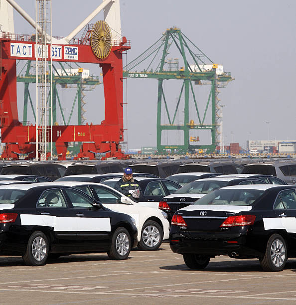 Toyota Motor Corp. autos sit at the at the port of Tianjin in Tianjin