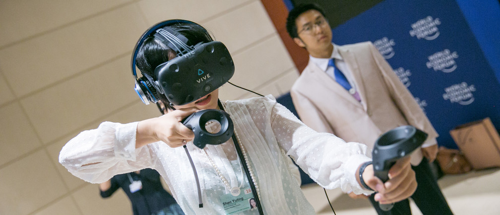 Participants experiencing Virtual Reality at the World Economic Forum Annual Meeting of the New Champions