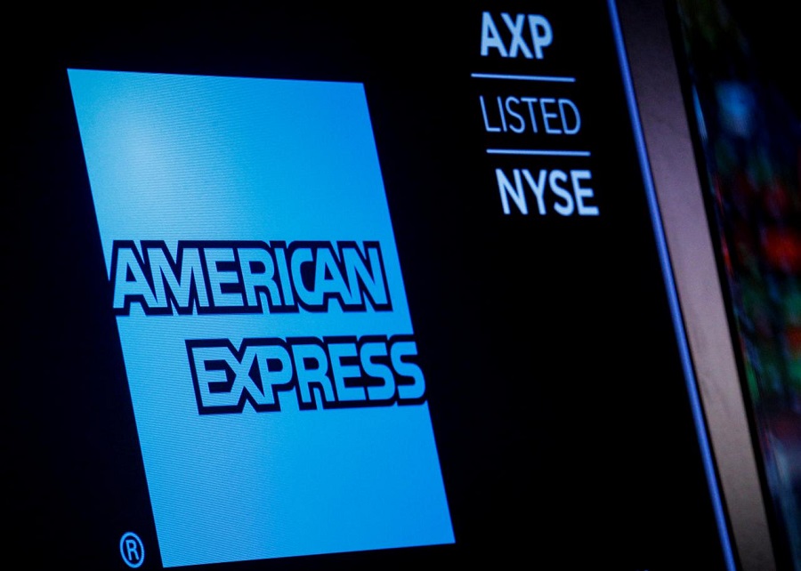 American Express logo and trading symbol are displayed on a screen at the New York Stock Exchange NYSE in New York