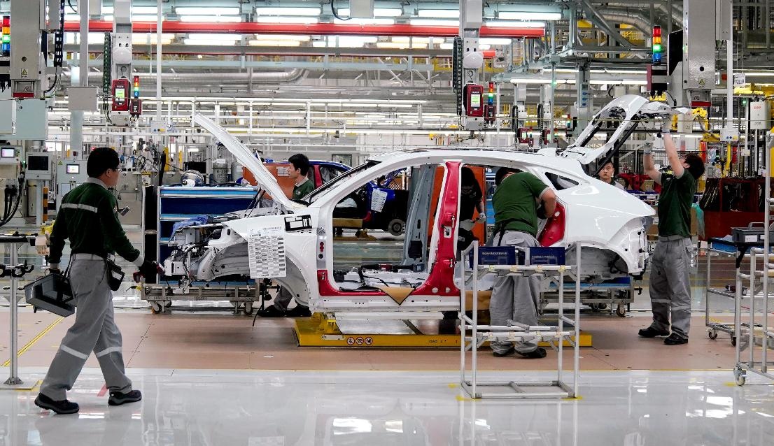 Employees work at the production line of the Chery Jaguar Land Rover plant in Changshu