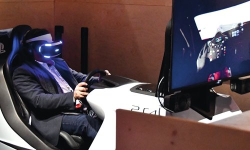 A man tries out the new Sony PlayStation VR during CES 2017