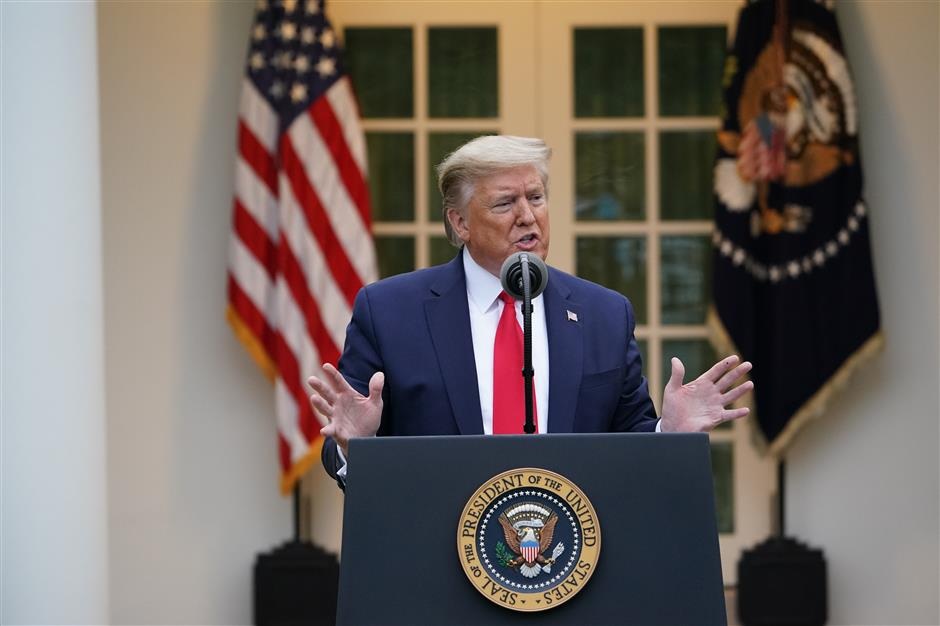 US President Donald Trump speaks during the daily briefing on the novel coronavirus in the Rose Garden of the White House on April 14 2020 in Washington DC