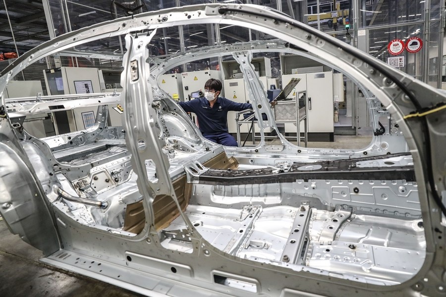 A man works at Tiexi Plant of BMW Brilliance Automotive in Shenyang