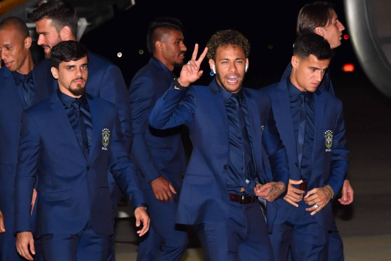 Brazils Fagner Neymar and Philippe Coutinho and the rest of the national team descend form the plan upon landing at Sochi airport in Russia