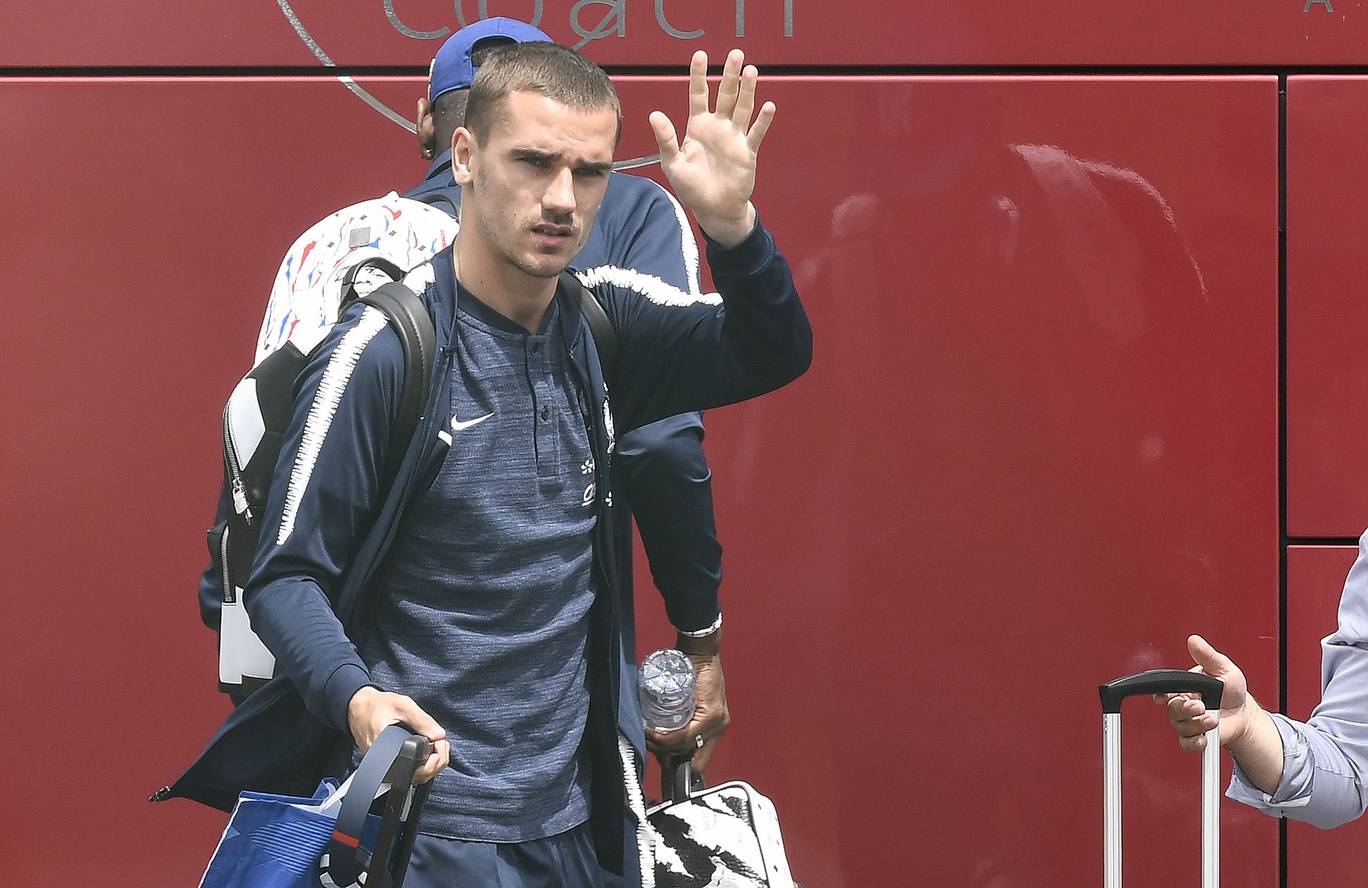 Frances forward Antoine Griezmann waves before taking a plane to Russia at the Brons airport near Lyon central eastern France