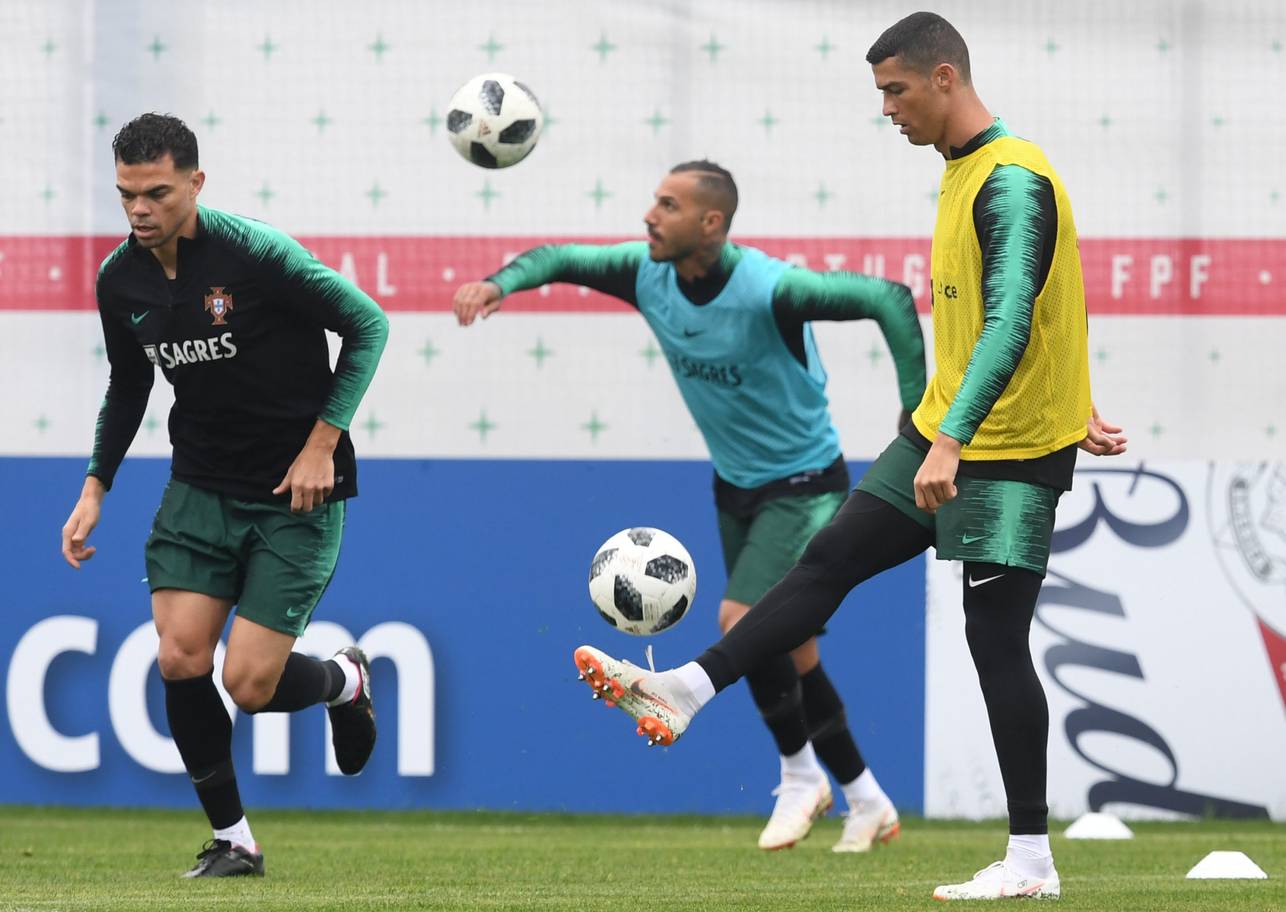 Portugals forwards Cristiano Ronaldo R and Ricardo Quaresma C and defender Pepe attend a training session at the teams base camp in Kratovo outskirts of Moscow