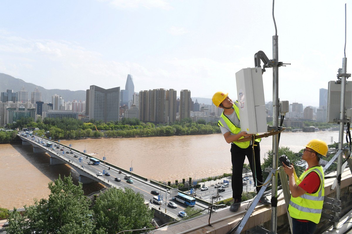 China Telecom technicians set up a 5G base station