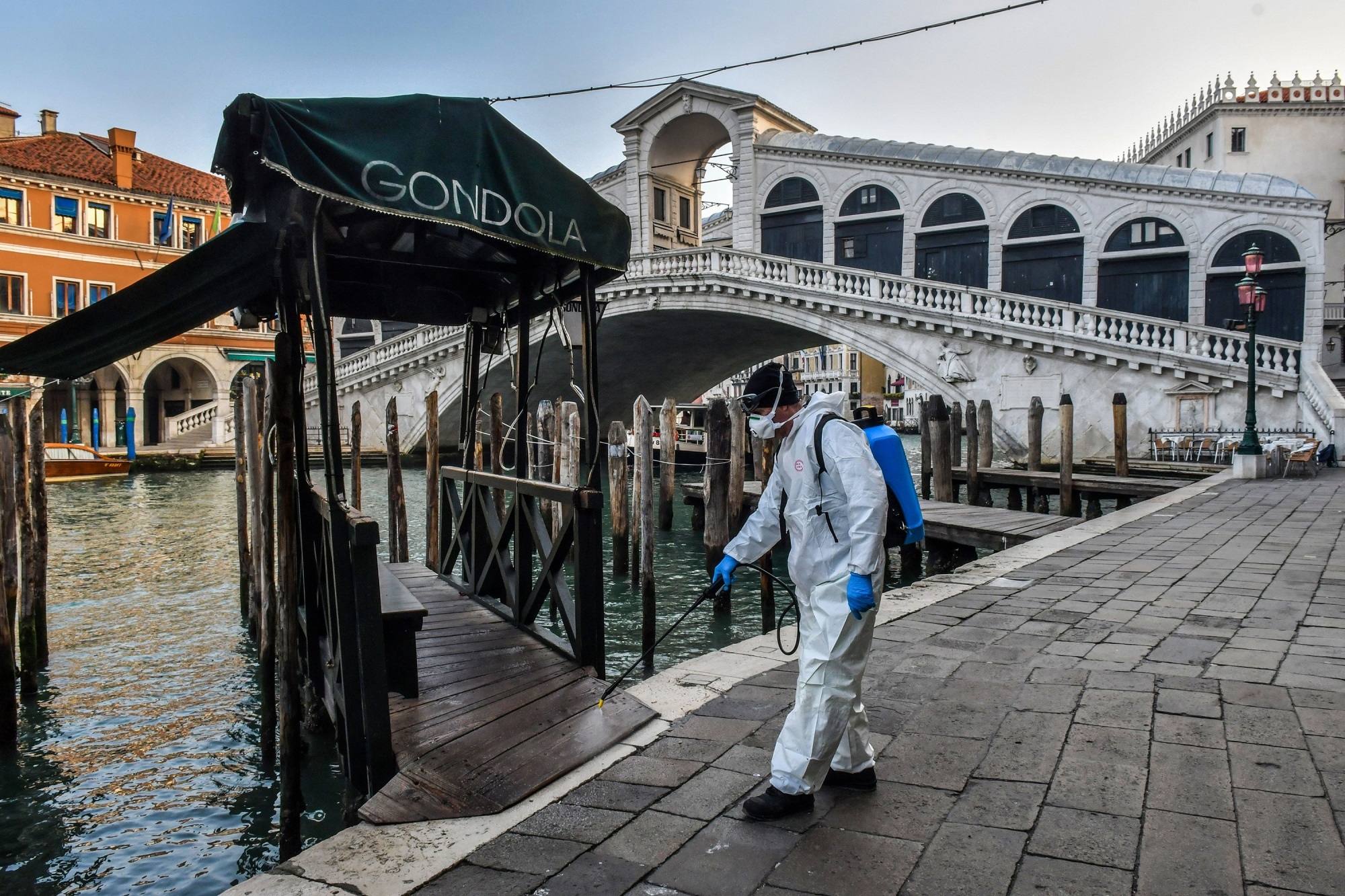 Spraying disinfectant at the Rialto Bridge in Venice