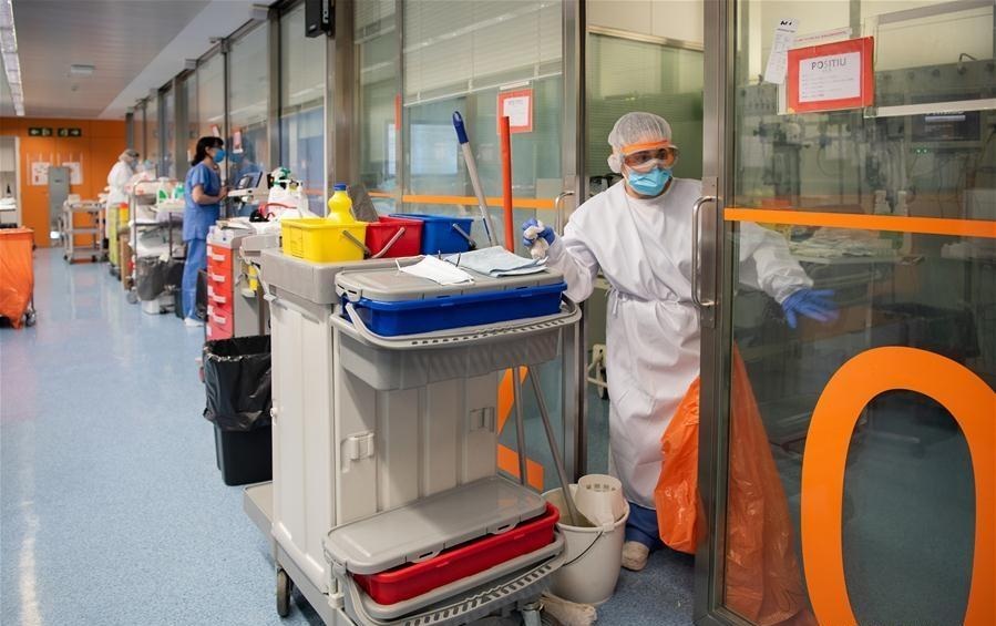 A staff member wearing protective gear cleans the COVID 19 ward at a hospital in Barcelona Spain on April 20 2020